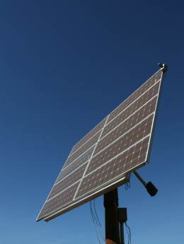A solar array with powered tracker to track the path of the sun across the sky.